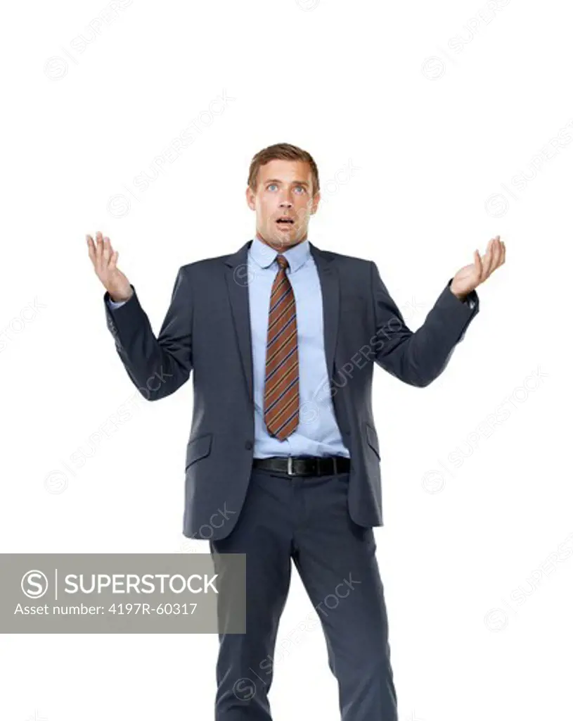 A handsome businessman gesturing in disbelief while isolated on a white background