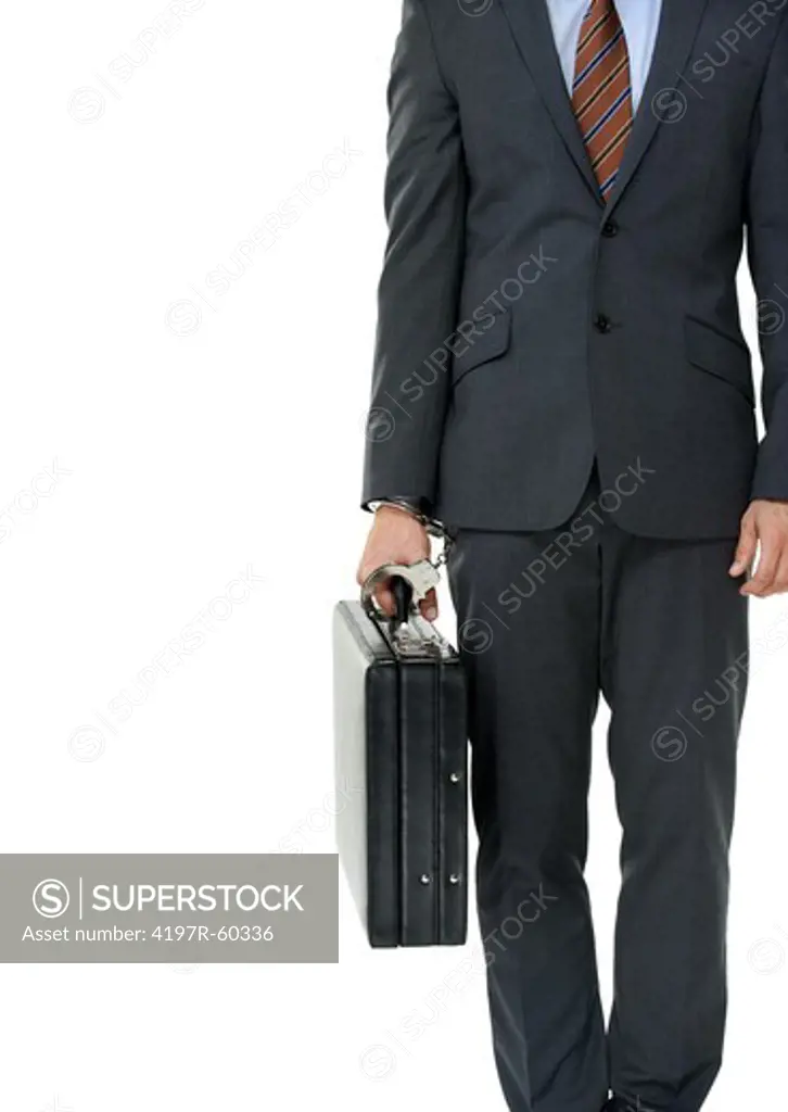 Cropped closeup of a businessman handcuffed to his briefcase
