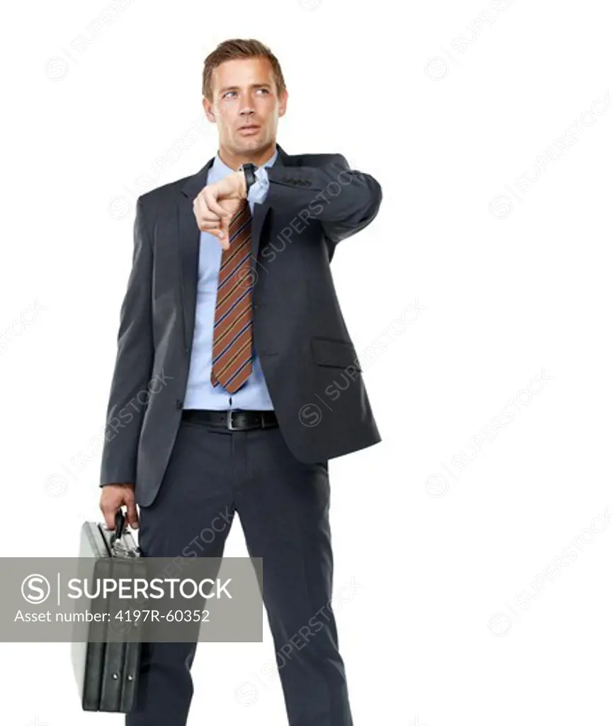 A thoughtful businessman checking his watch while isolated on a white background