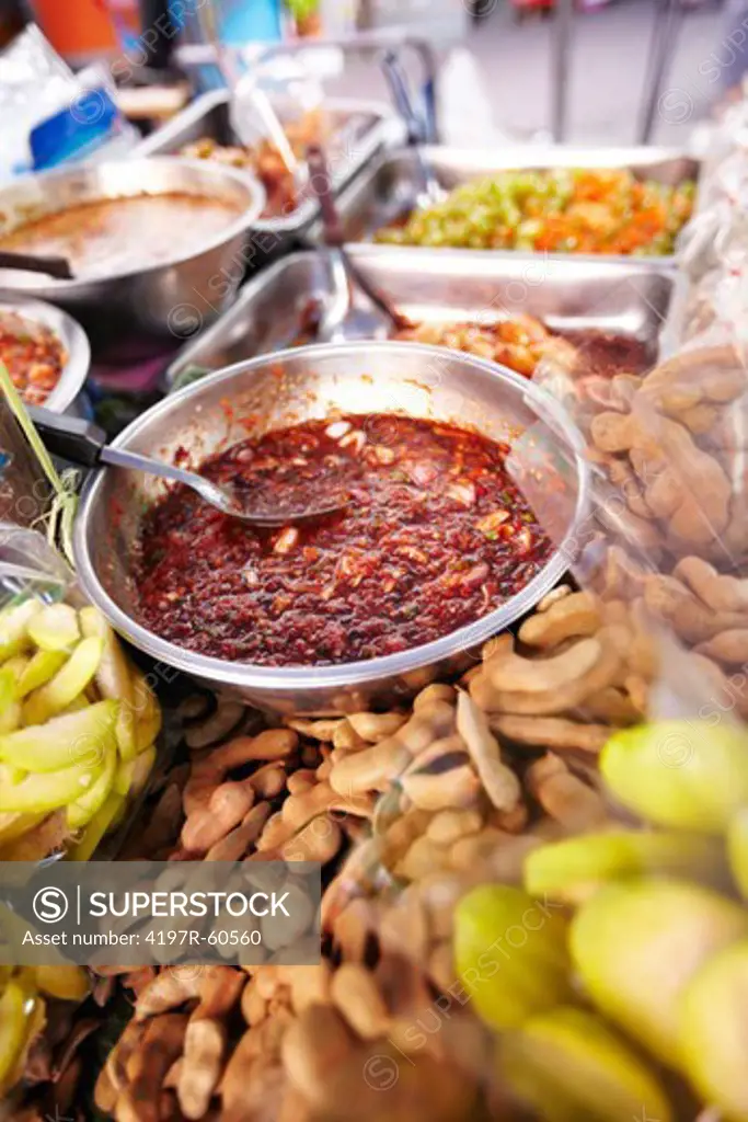 A bowl of chilli paste at a market stall selling dried ingredients