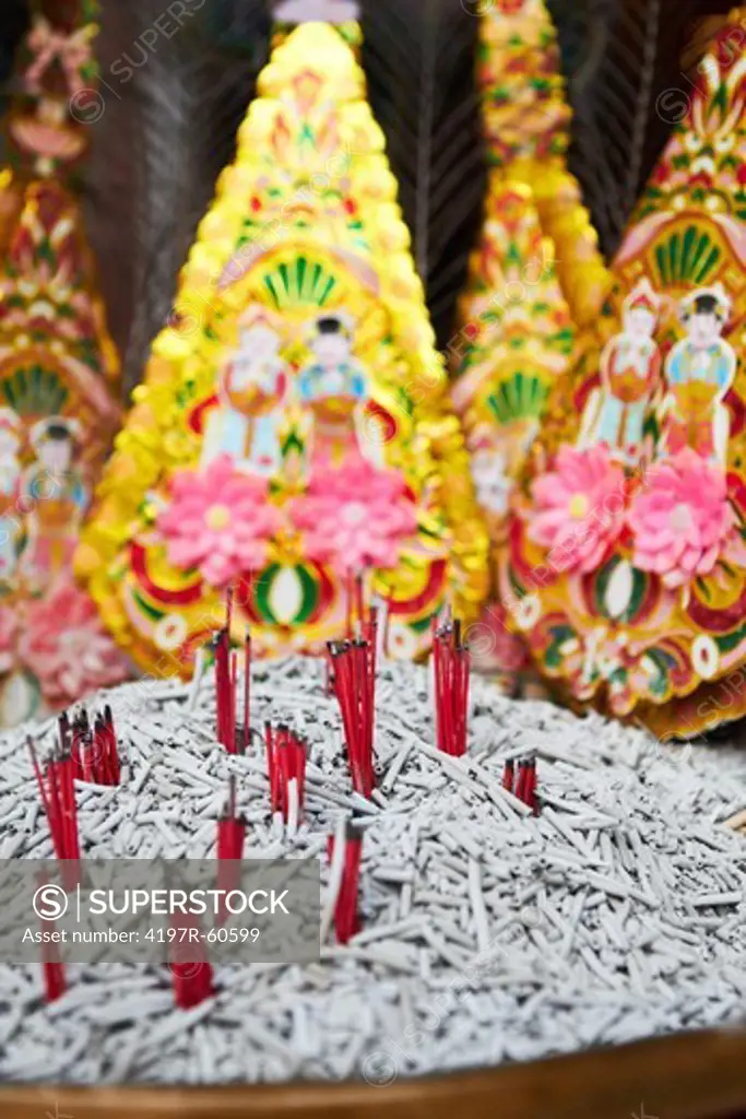 A bowl of ash from burnt joss sticks in a Thai temple