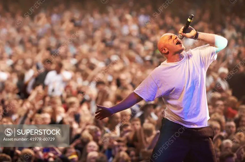 Vocal frontman performing for a frenzied crowd of fans