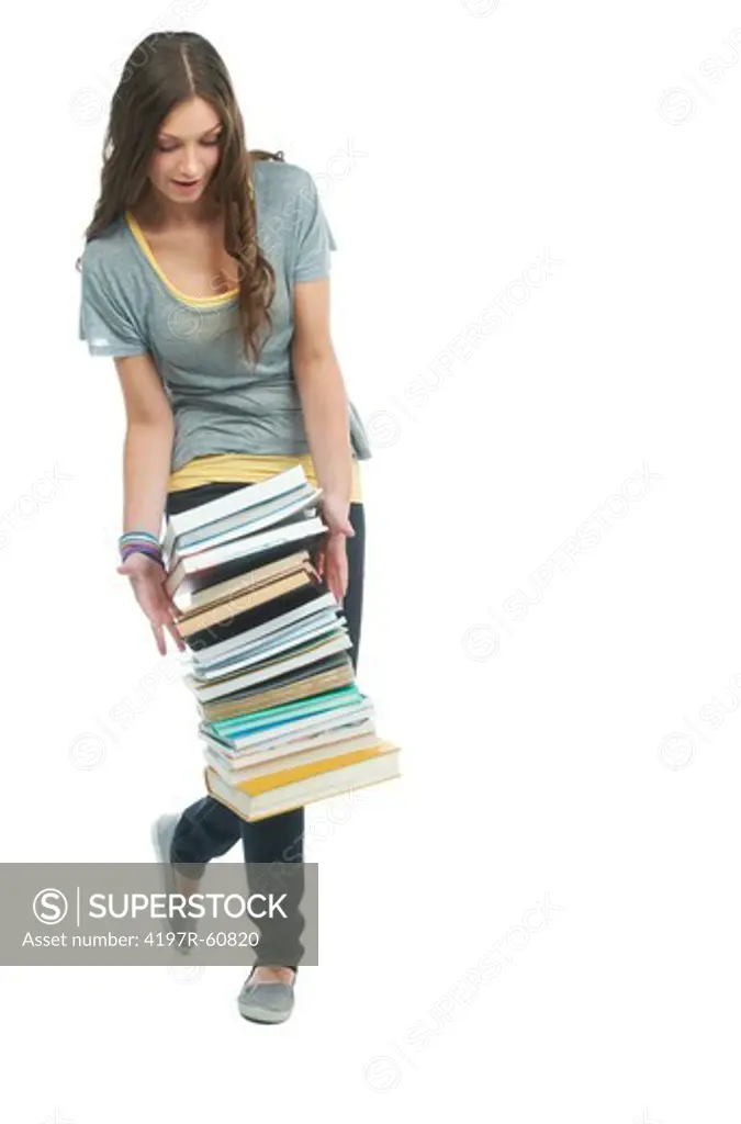 A gorgeous young student dropping a stack of books