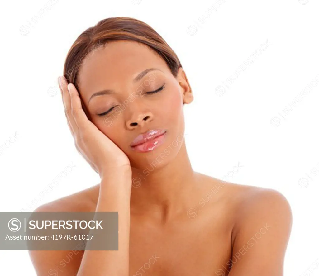 A young woman with her eyes closed in a white background