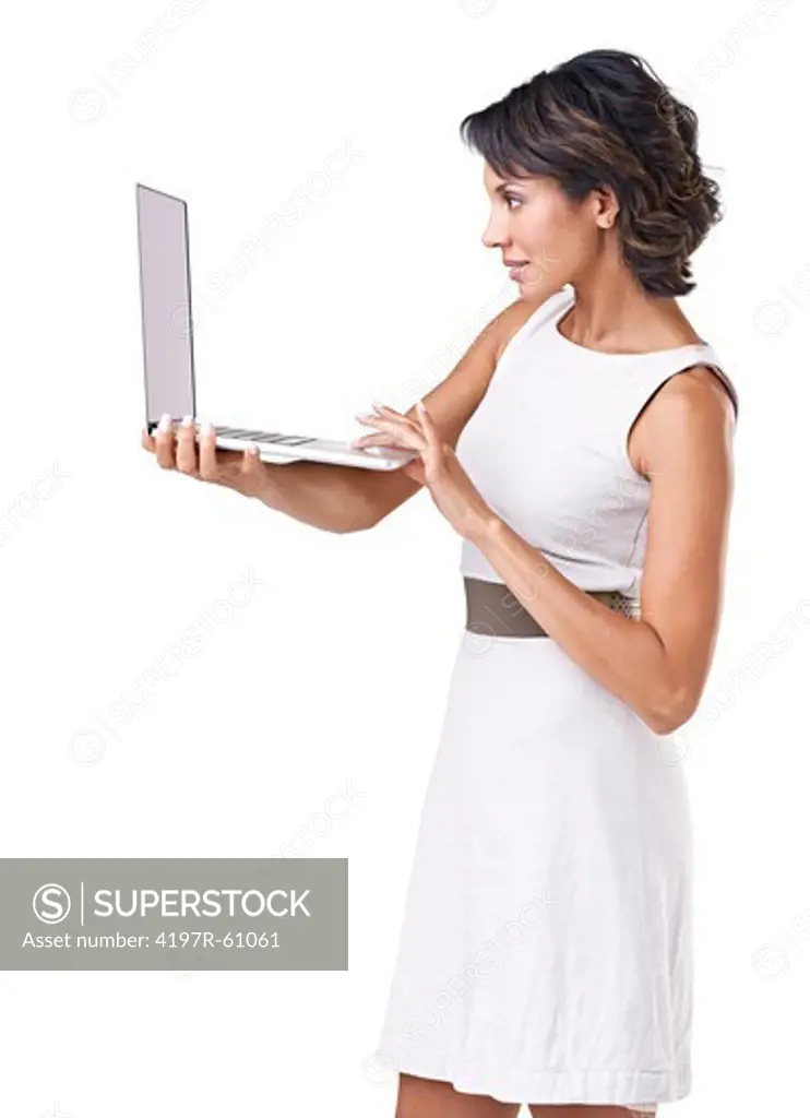 Beautiful young ethnic woman working on her laptop