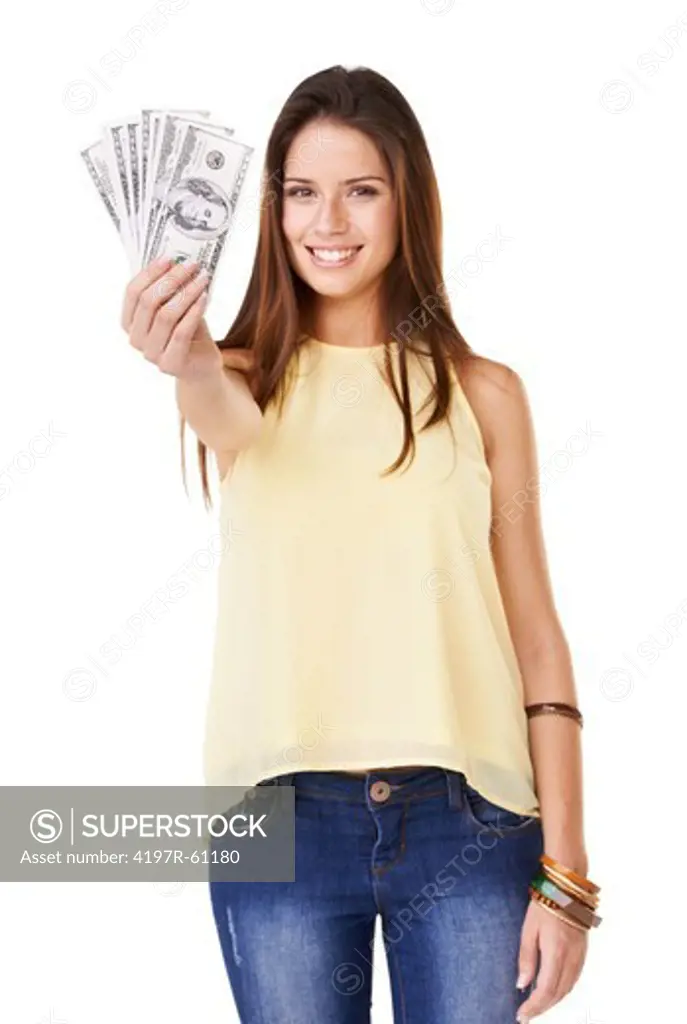 Studio shot of an attractive young woman  holding up fanned out banknotes isolated on white