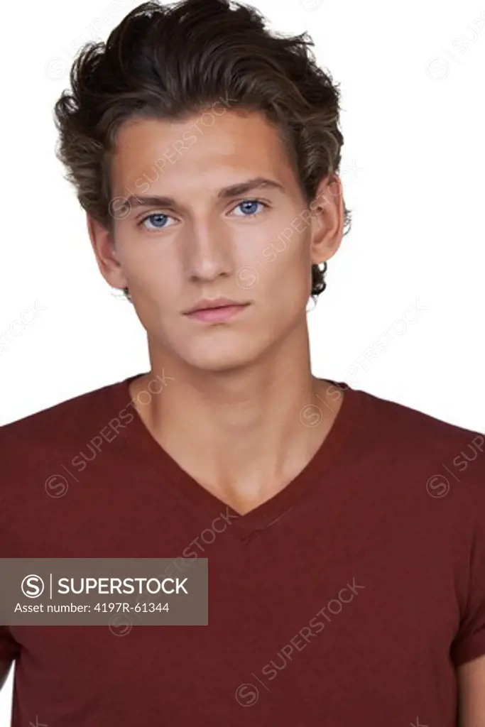Serious young guy looking at you against a white background