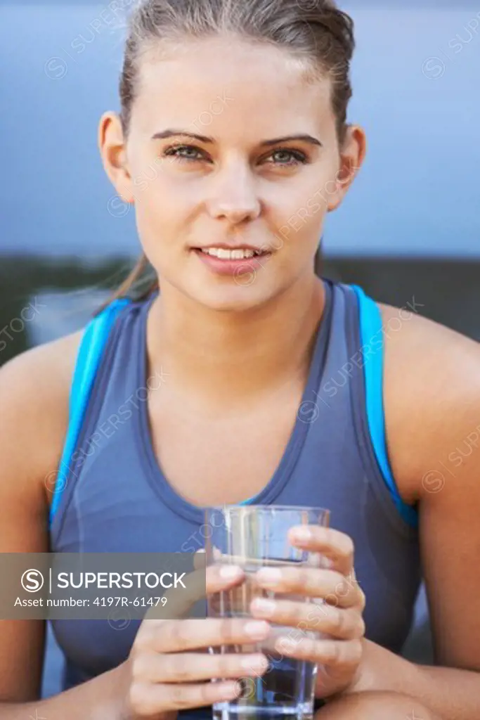 A teenage girl drinking water