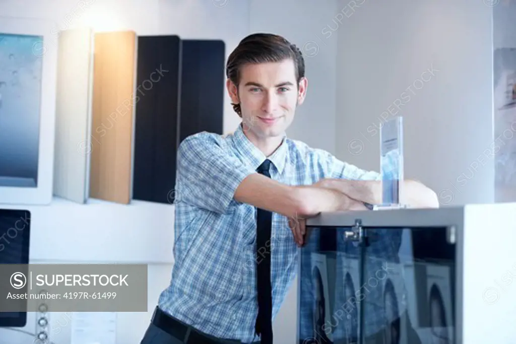 A portrait of a smiling male employee