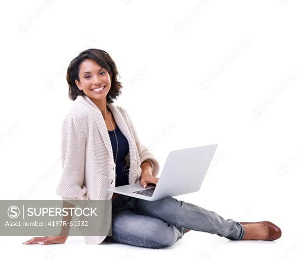 Smiling young African-American woman sitting relaxed with a laptop in her lap