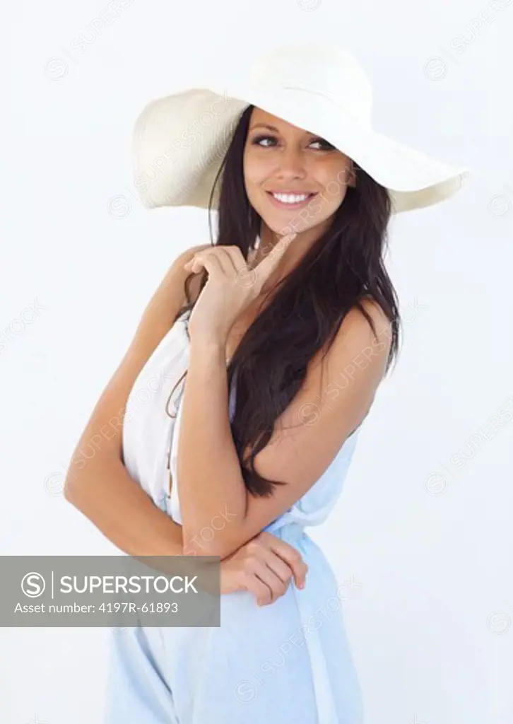 A stunning young woman wearing a sunhat thinking about something