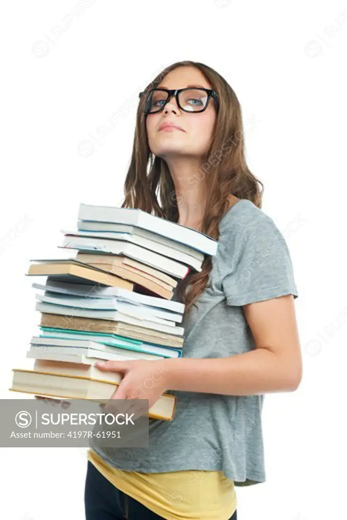 A gorgeous young woman carrying a stack of books