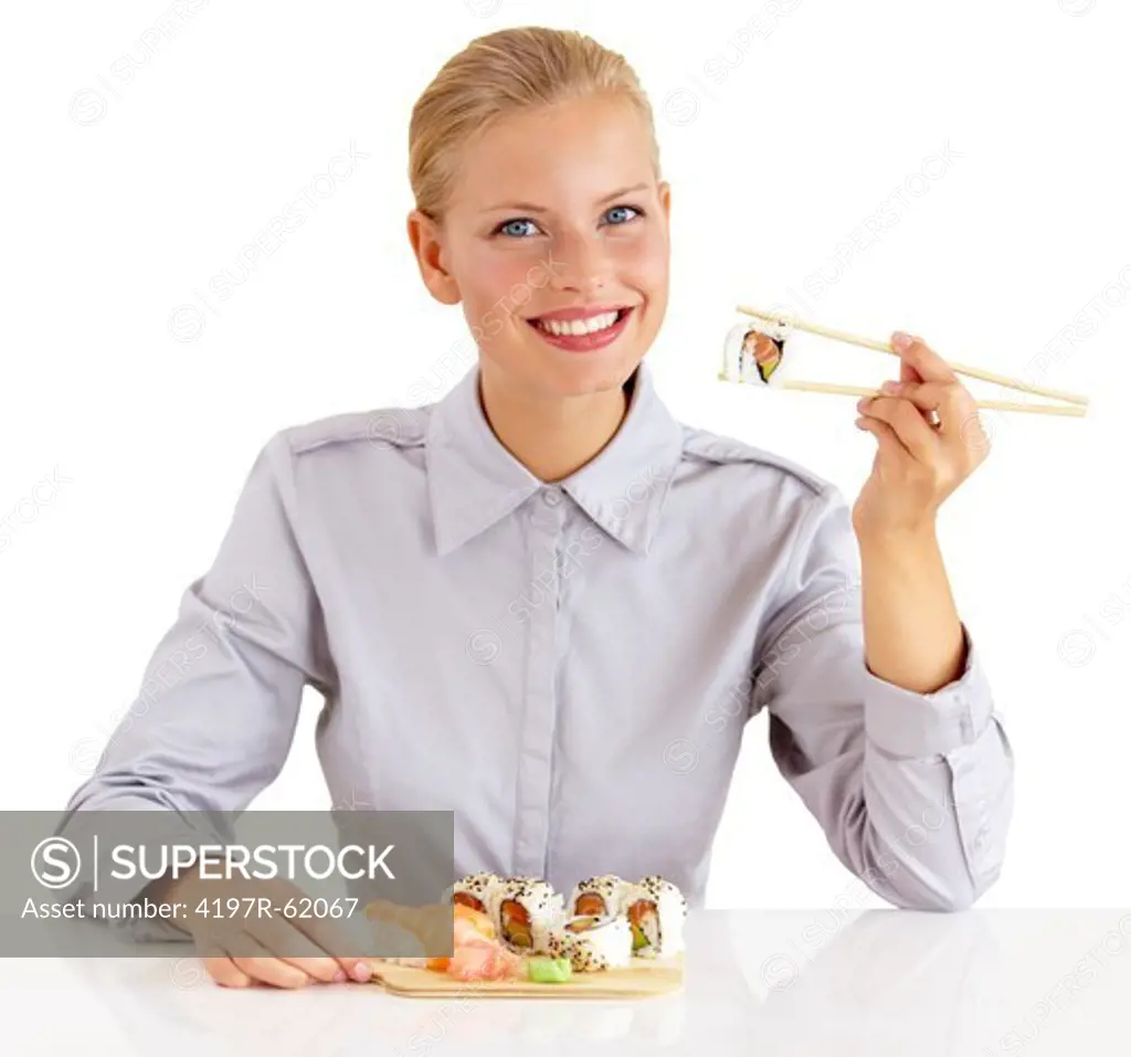 Portrait of an attractive young woman eating portion of sushi