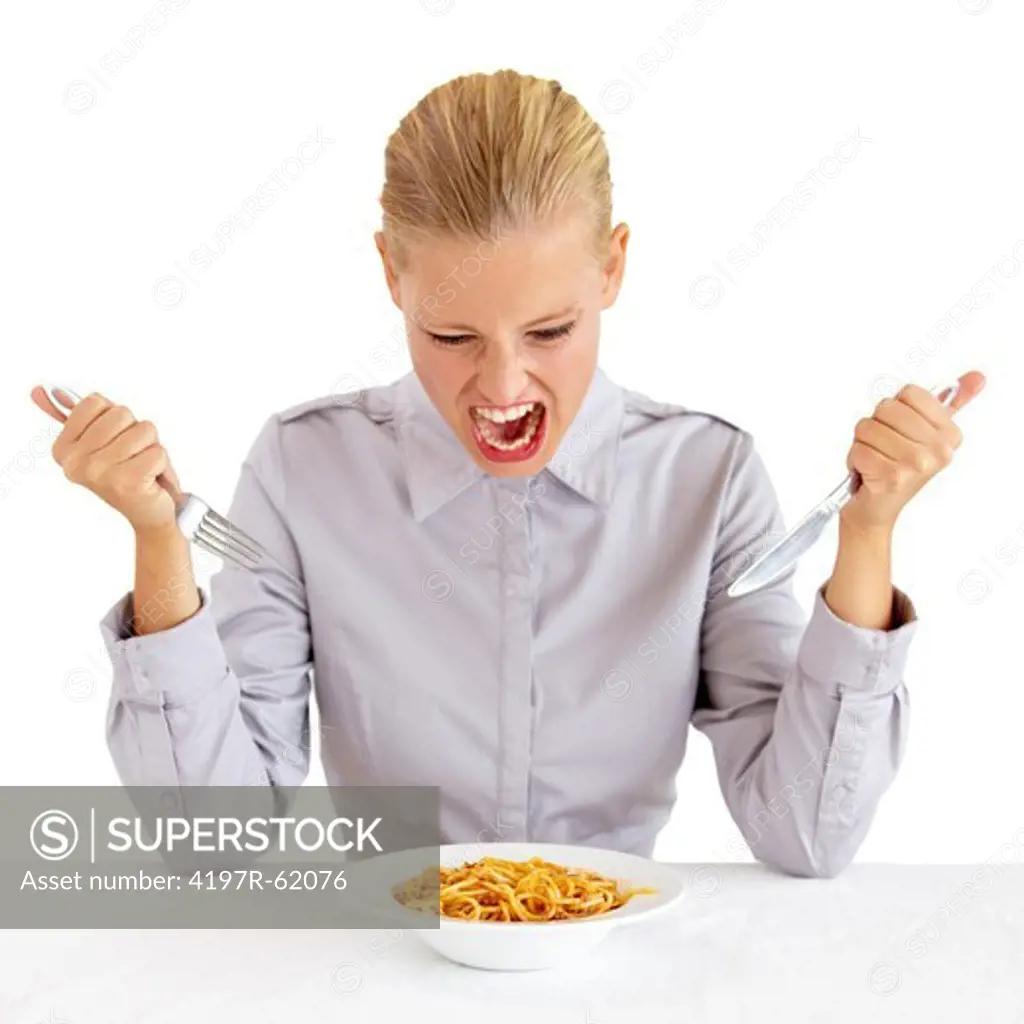 Portrait of an attractive young woman eating a bowl of pasta