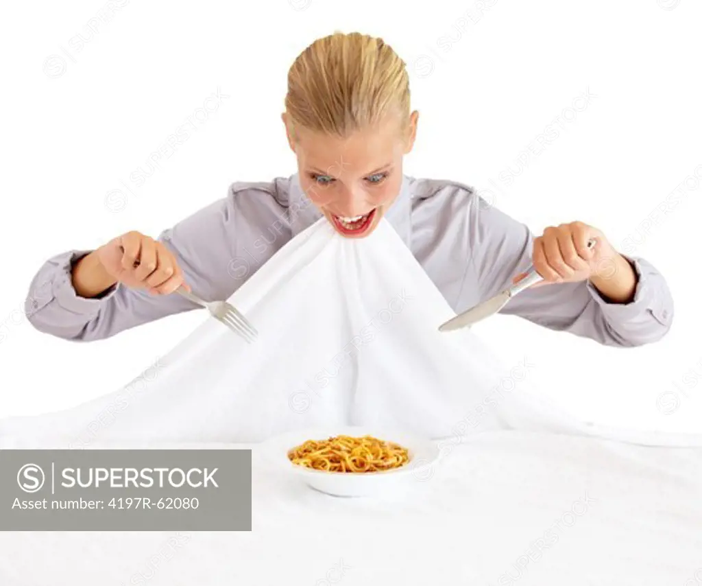 An attractive young woman attacking a bowl of pasta