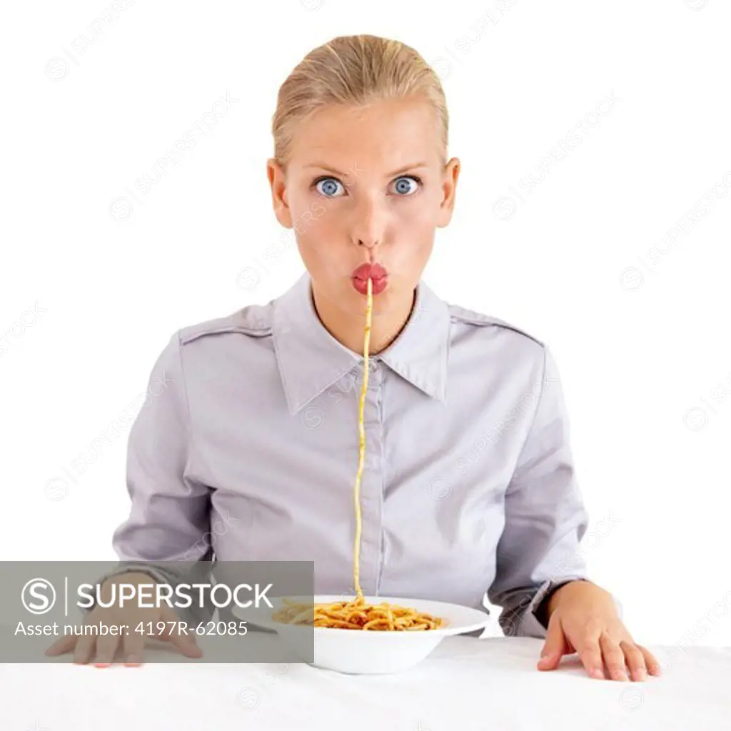 Portrait of an attractive young woman slurping a string of p