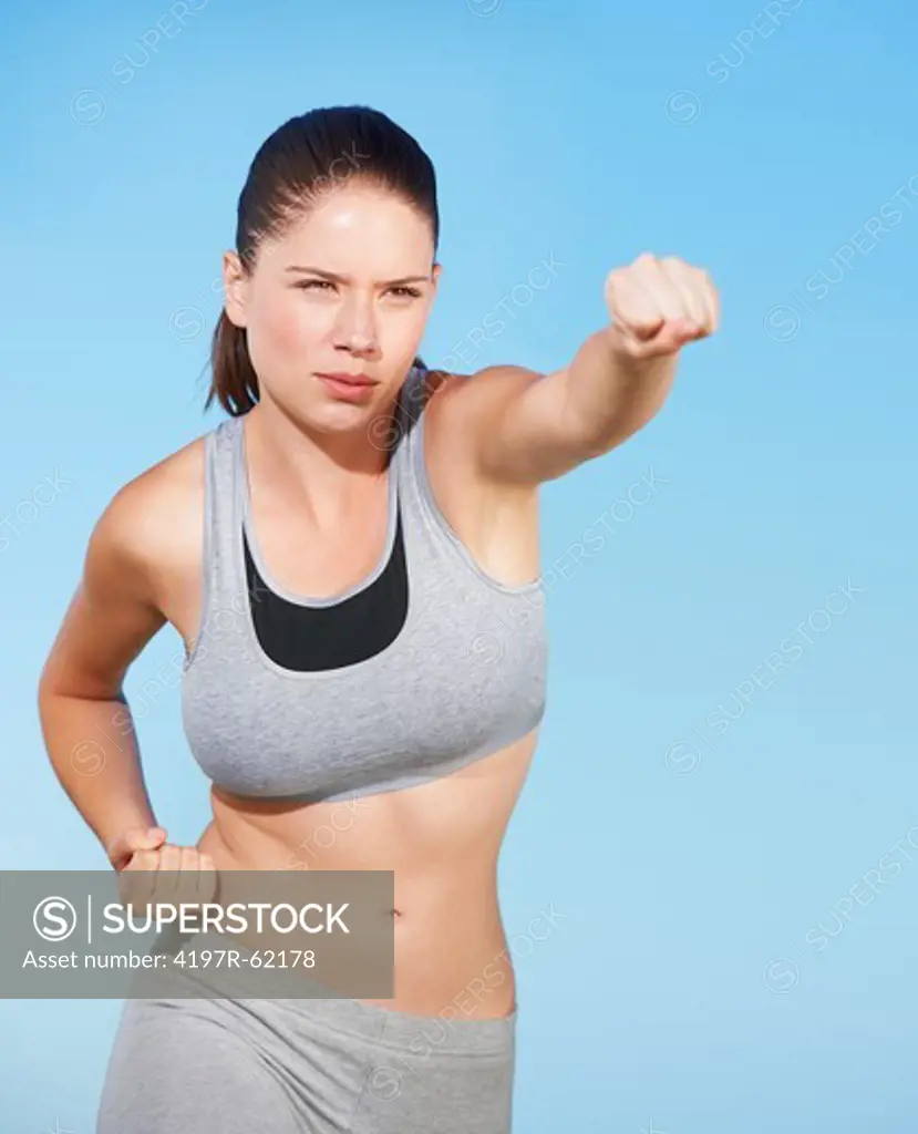 An attractive young woman exercising outside