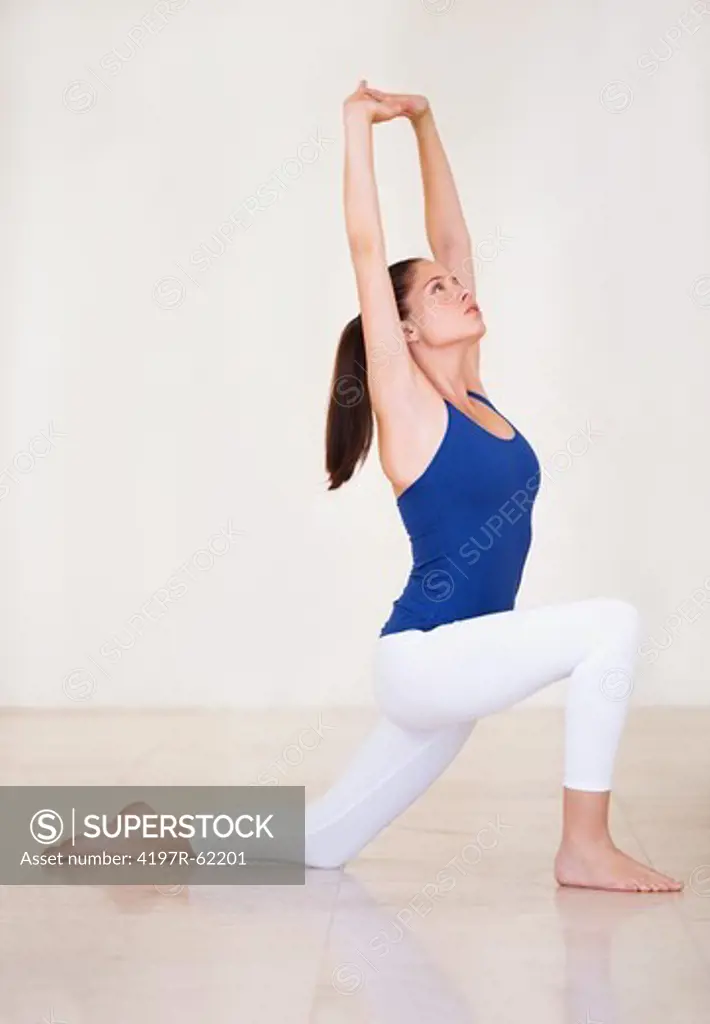 Fit young woman doing exercises and stretching out