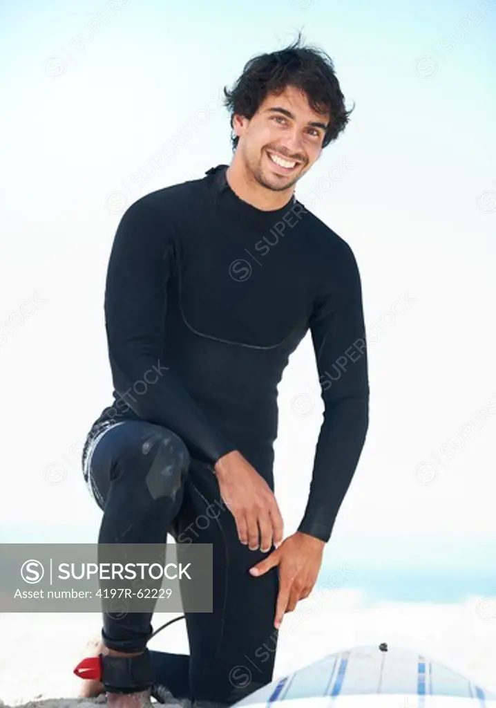 Portrait of a young male surfer with his wetsuit on