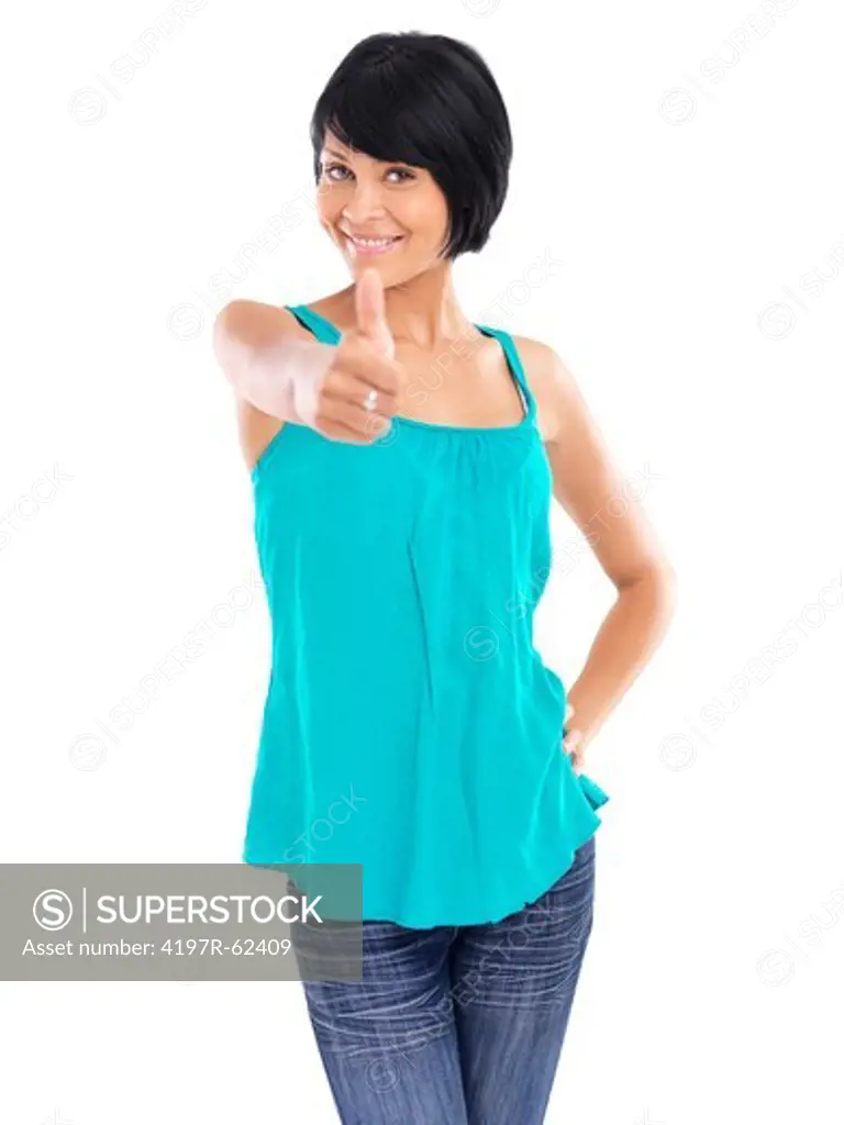 Casual young woman smiling while giving a thumb's up and standing against a white background