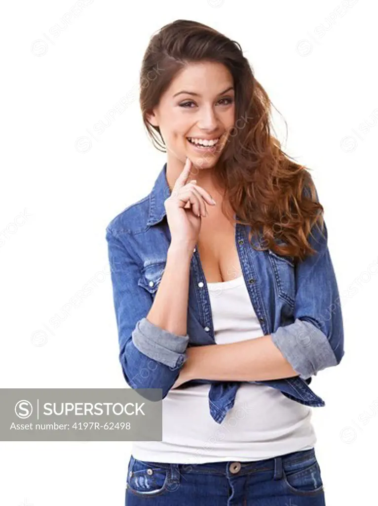 Studio portrait of an attractive young woman  with her hand on her chin and laughing at the camera isolated on white