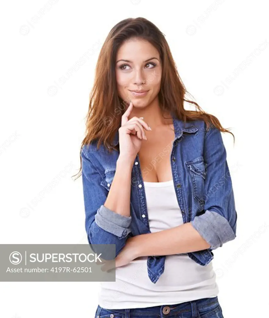Studio shot of an attractive young brunette with her hand on her chin and looking out of frame isolated on white