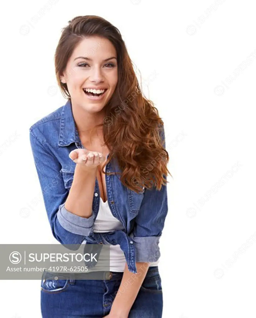 Studio portrait of a beautiful woman blowing a kiss at the camera and laughing isolated on white
