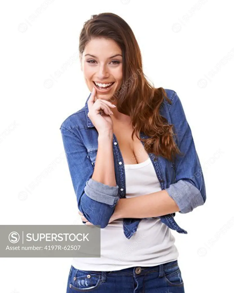 Studio portrait of an attractive young woman  with her hand on her chin and laughing at the camera isolated on white