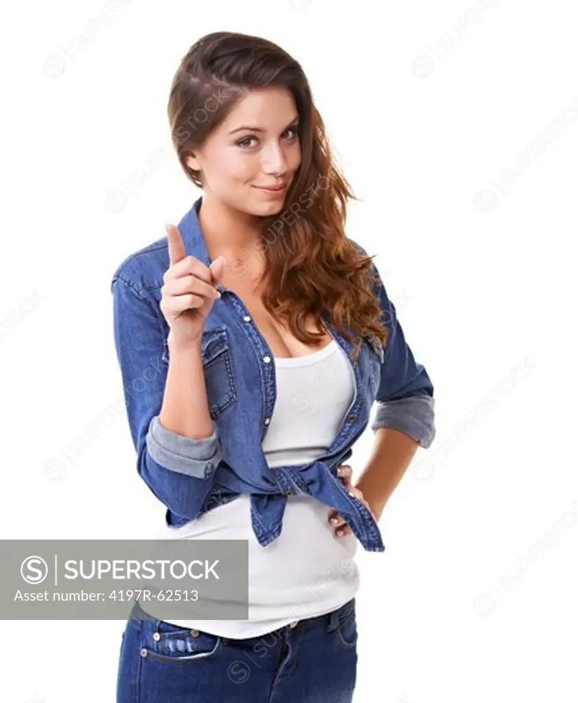 Studio shot of a beautiful young woman smiling and shaking a finger at the camera isolated on white