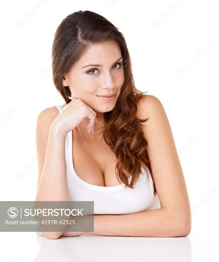 Studio portrait of an attractive woman with her hands on her chin isolated on white