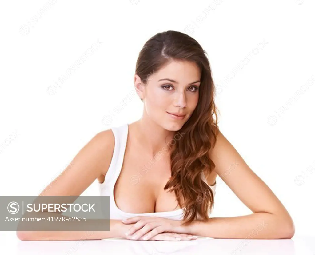 Studio portrait of a attractive woman looking alluringly at the camera isolated on white