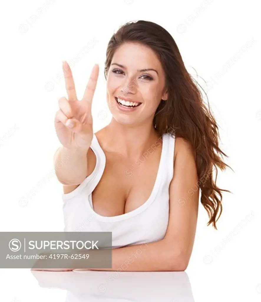 Shot of an attractive young woman giving the 'peace' to the camera and smiling