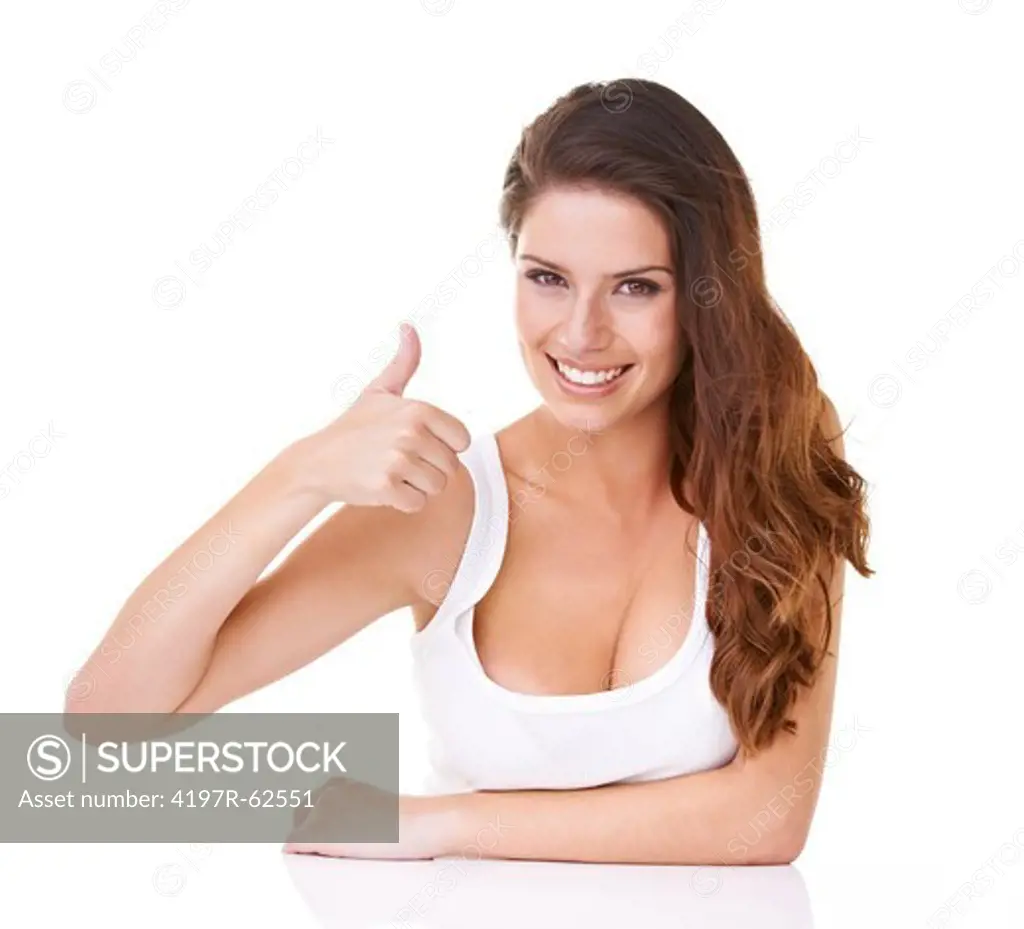 Studio portrait of a young woman giving a 'thumbs up' sign to the camera isolated on white