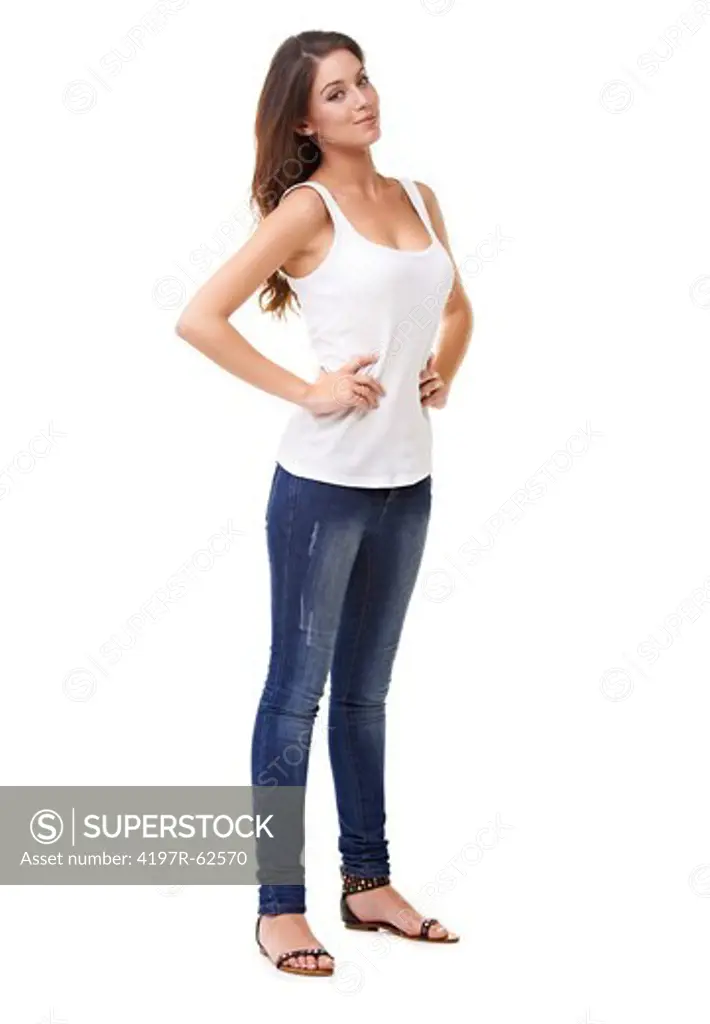 Full length studio portrait of an attractive young woman standing with her hands on her hips isolated on white