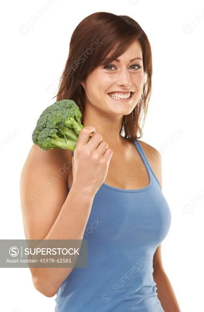 Studio portrait of an attractive young women holding a head of broccoli isolated on white