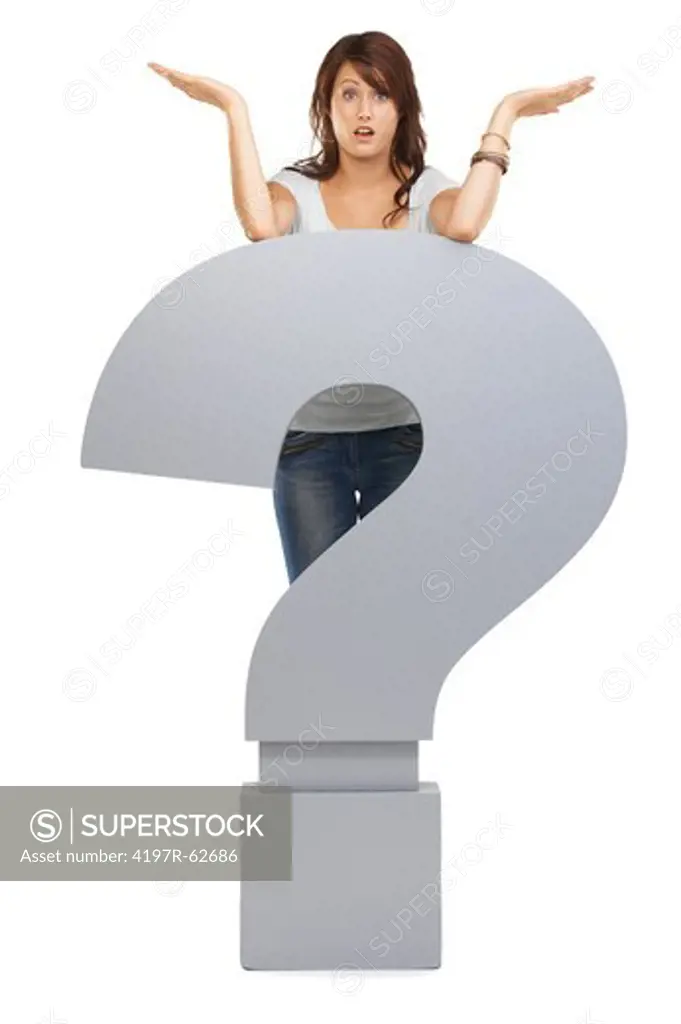 Full length studio concept shot of a confused-looking young woman standing behind a large question mark isolated on white