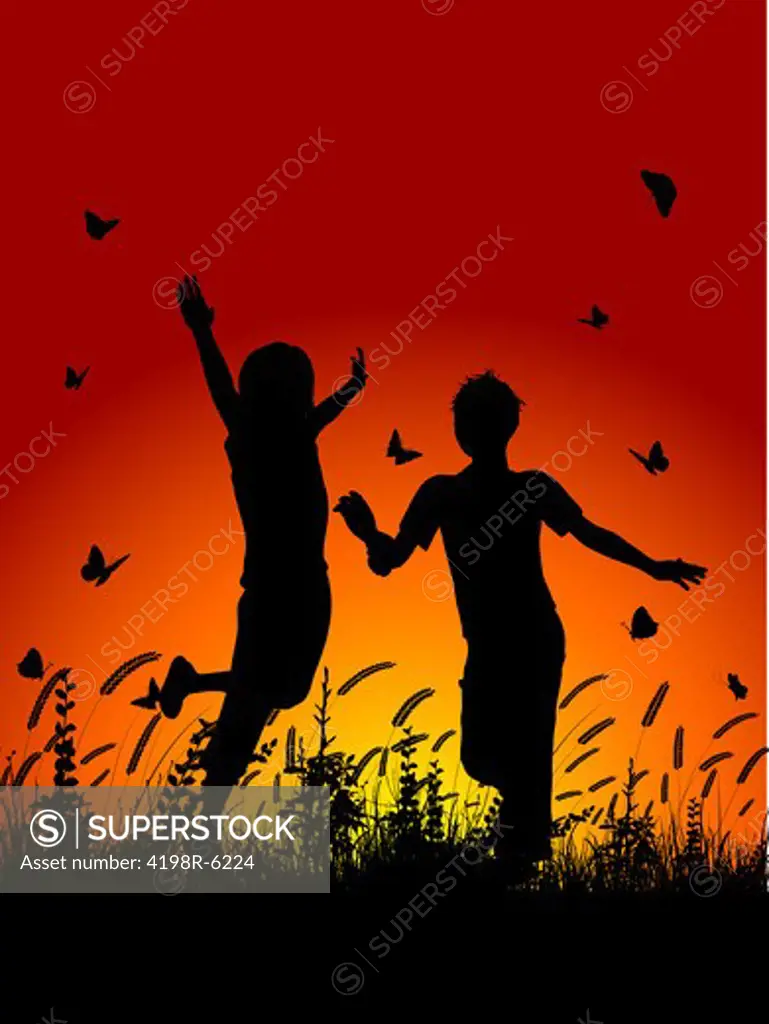 Silhouettes of children running in grass with butterflies