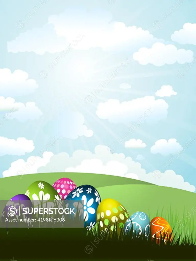 Colourful Easter eggs in grass on a sunny landscape background