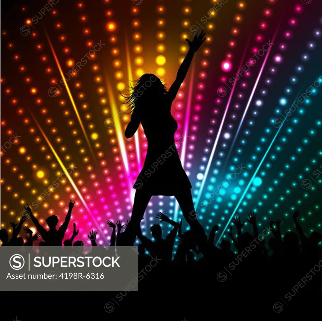 Silhouette of a female singer performing in front of a crowd