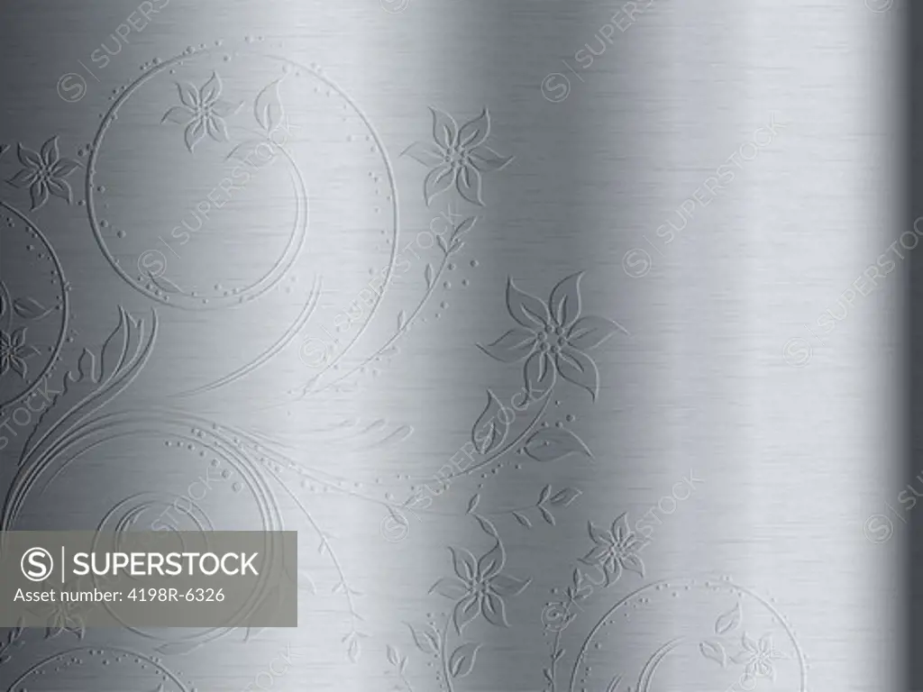 Brushed metal texture background with floral design embossed  on it