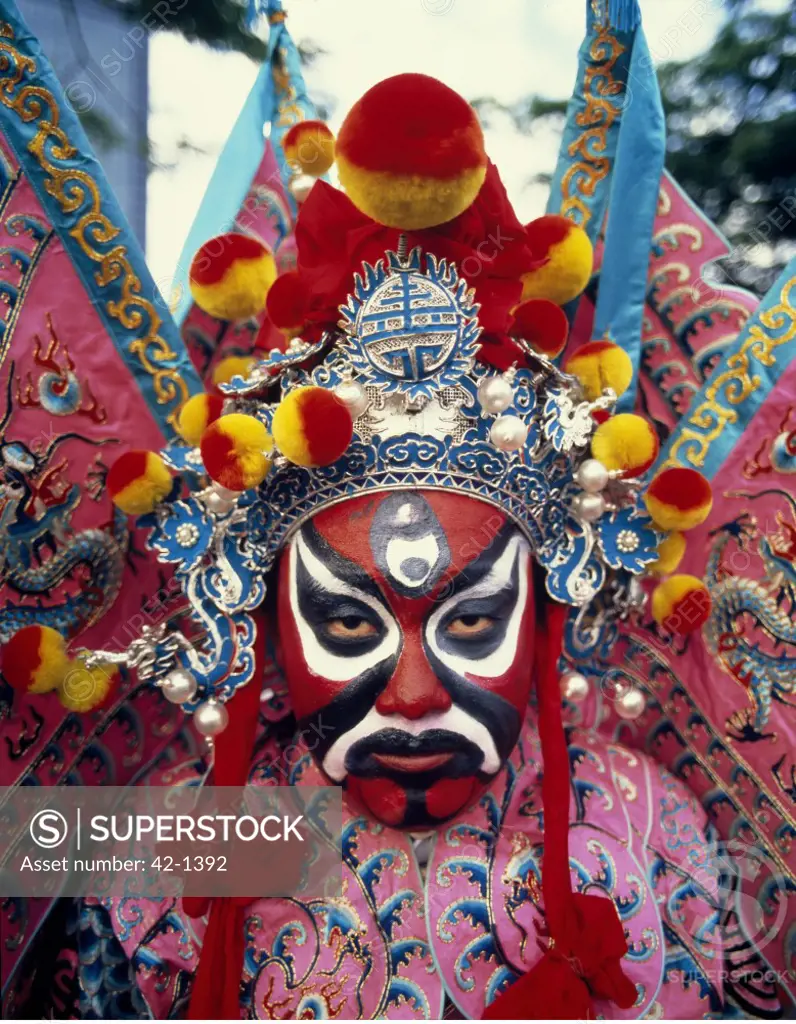 Close-up of a person with a painted face in a traditional festival, Chinese Opera, Singapore