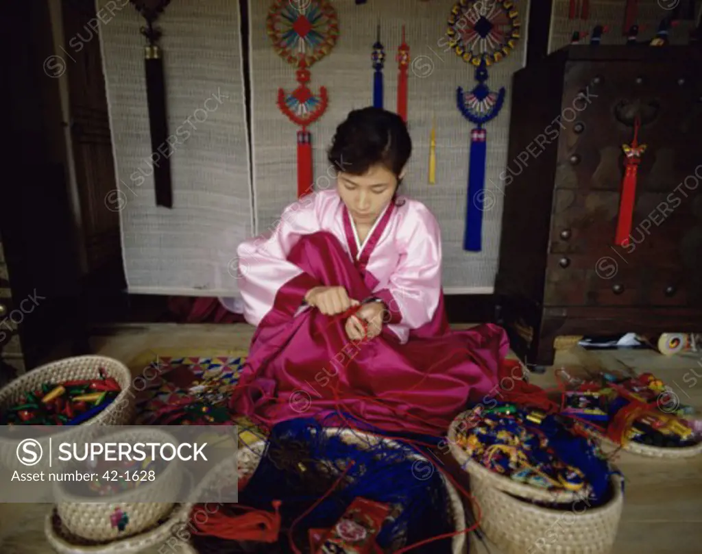 Young woman making craft products, Korean Folk Village, Seoul, South Korea