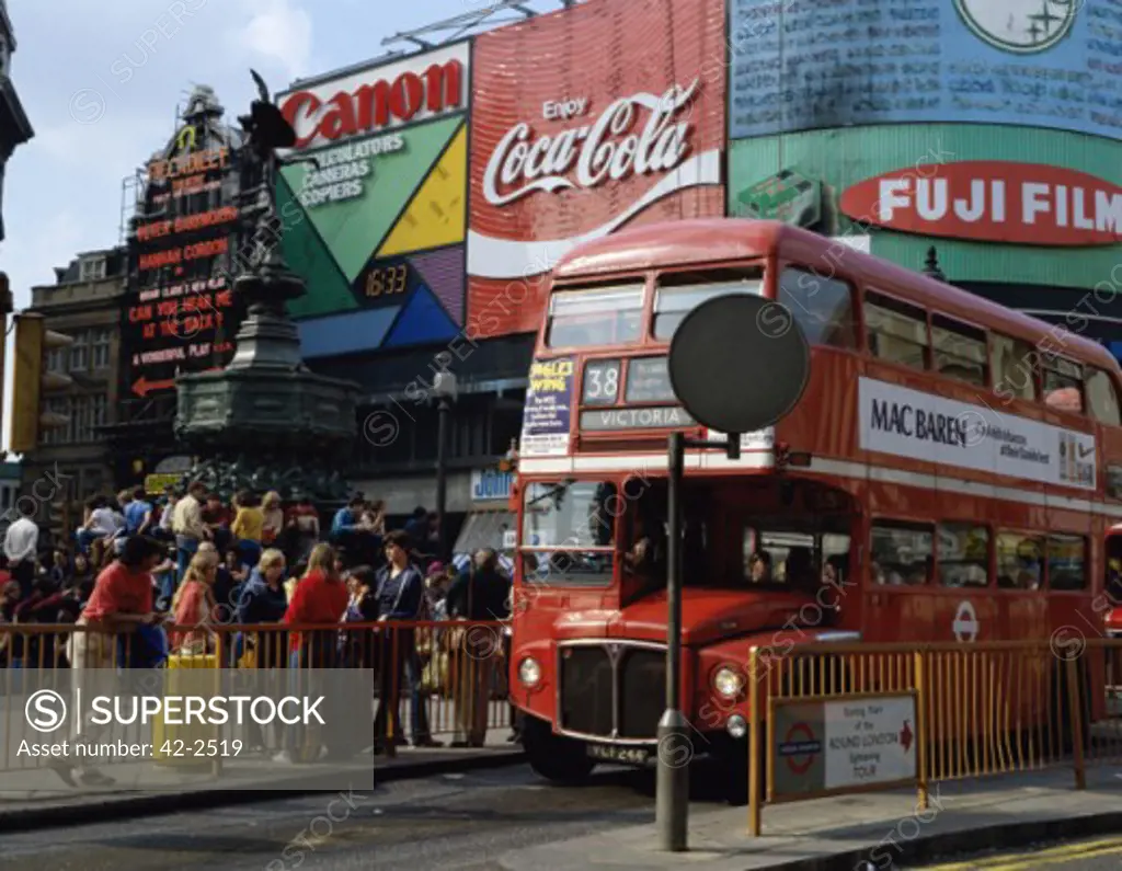 Double-decker bus on a road, Piccadilly Circus, London, England