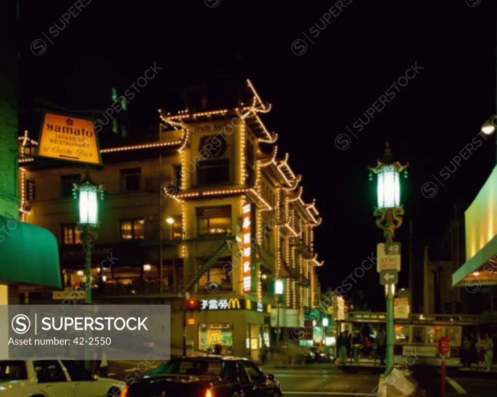 Low angle view of buildings lit up at night, Chinatown, San Francisco, California, USA