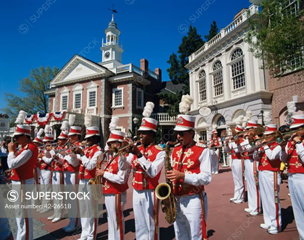 Marching band in front buildings, Liberty Square, Magic Kingdom, Orlando, Florida, USA
