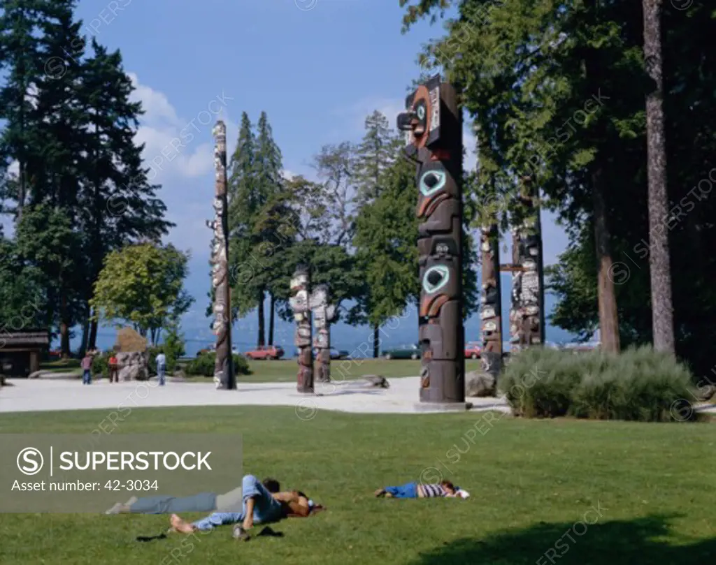 Tourists resting in a garden, Stanley Park, Vancouver, British Columbia, Canada