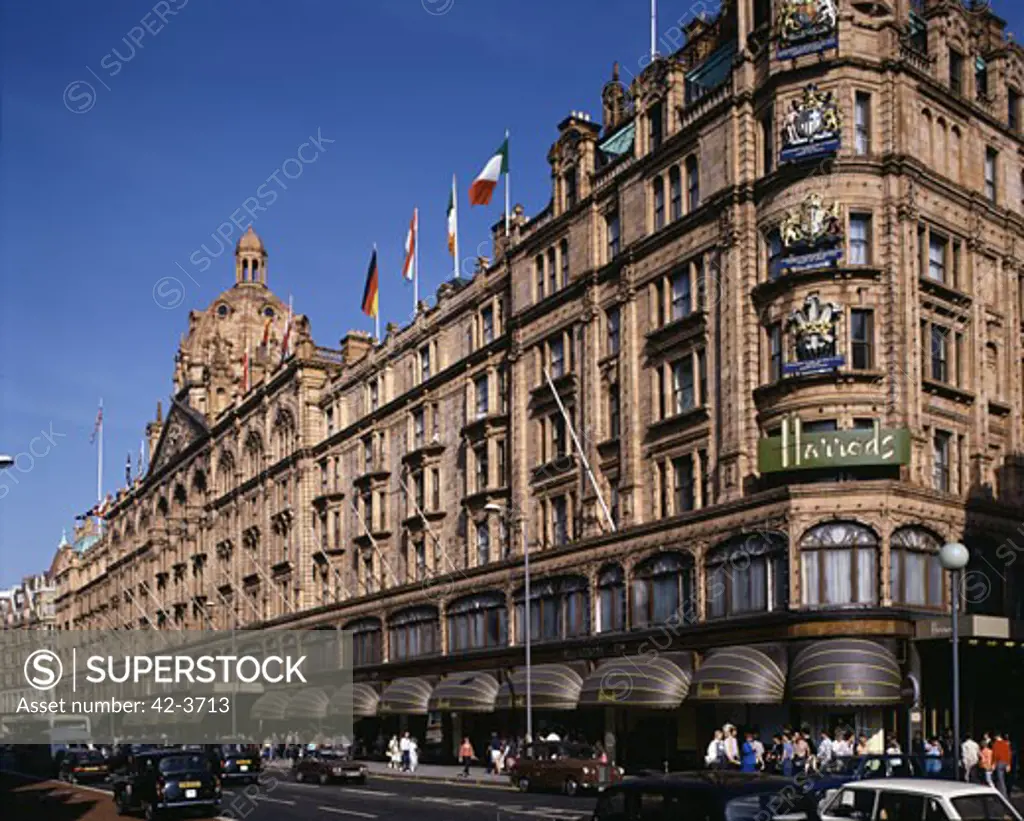 Low angle view of a building along a road in a city, Harrods, London, England