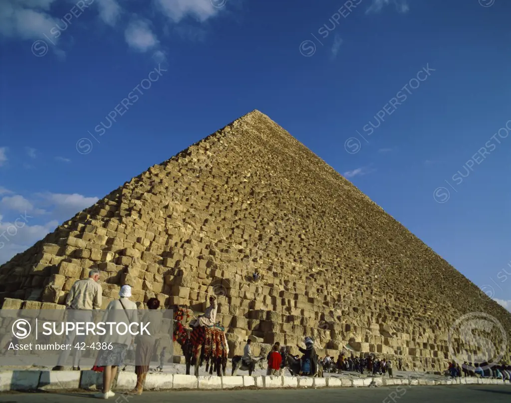 Tourists looking at a pyramid, Giza Pyramids, Giza, Egypt