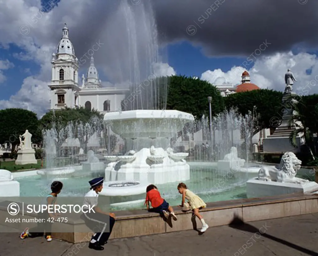 Four children at a fountain, Ponce De Leone, Puerto Rico