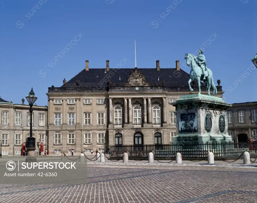 Statue in front of a palace, Amalienborg Palace, Copenhagen, Denmark